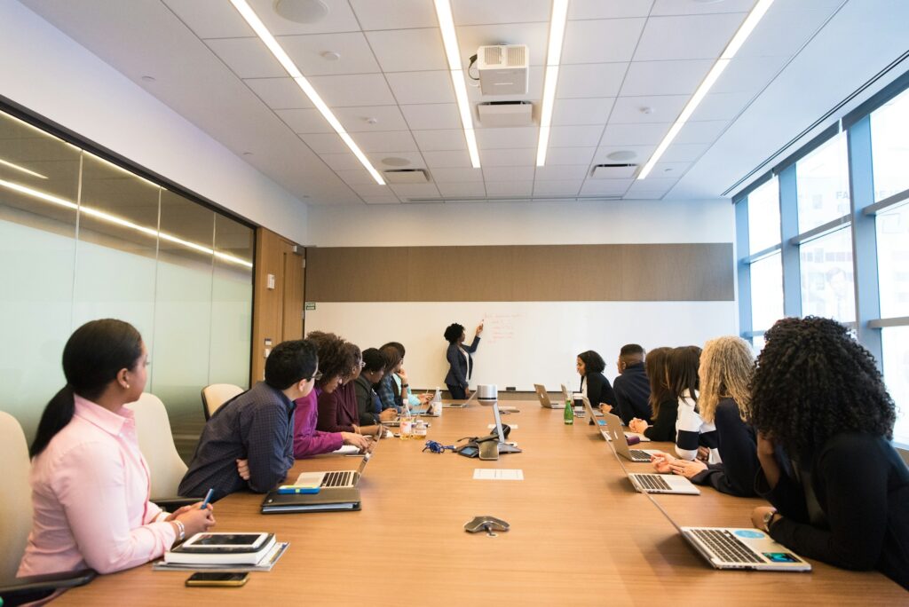 Marketing team discussing an ad campaign around a conference table