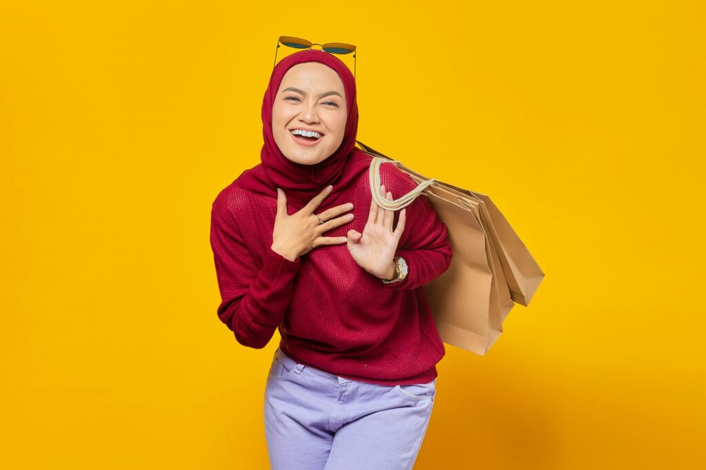 Woman carrying shopping bags after a day of shopping