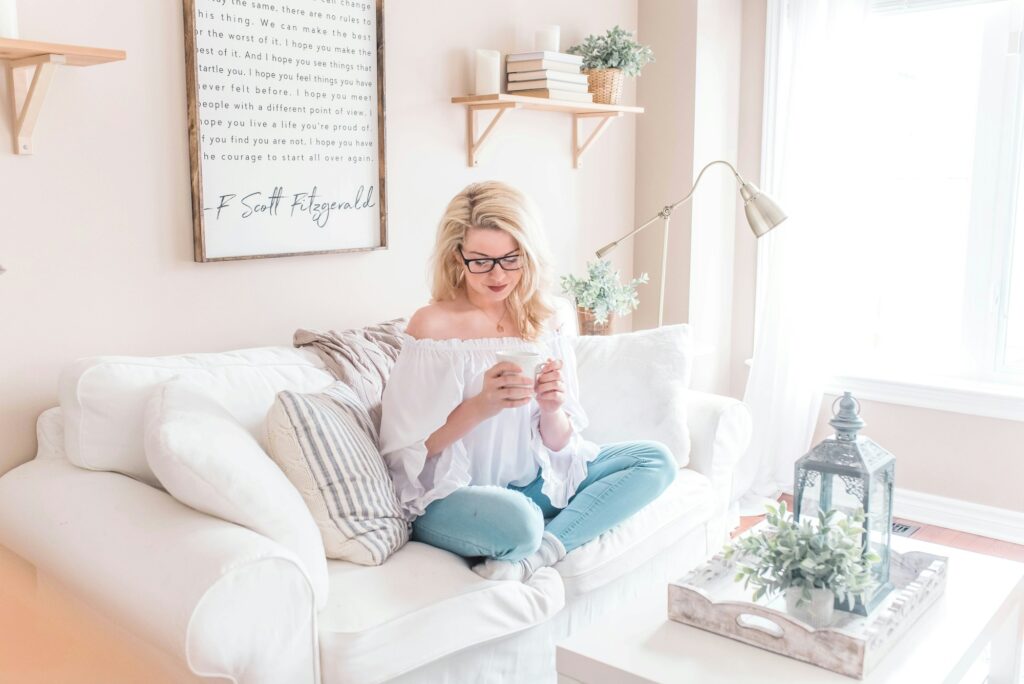 Woman relaxing on a sofa in a styled living room